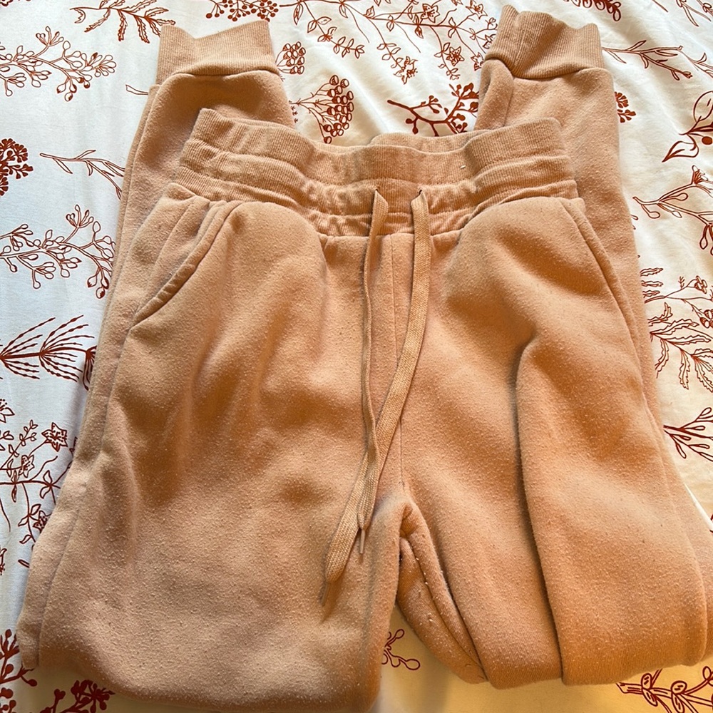 Pink sweatpants.